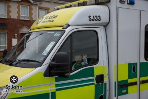 Charlie gets a lift in the front of the ambulance used to safe his life